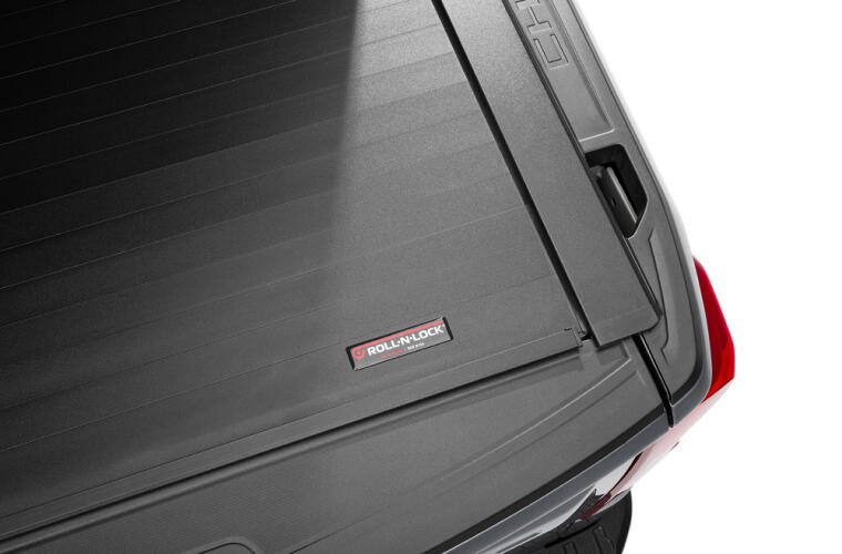 Product of Roll-N-Lock E-Series Hard Power Retractable RC263E Tonneau Cover 
