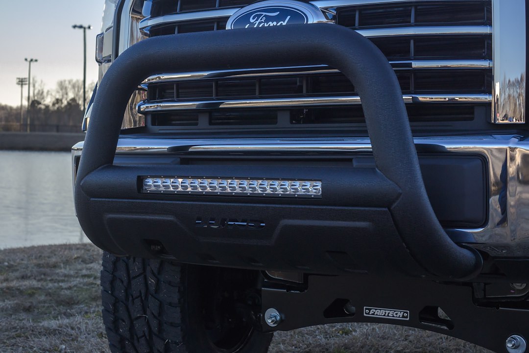 Product of Lund International 47121206 Bull Bar Black Wrinkle Powder Coated 3-1/2 Inch Yes with skid plate 